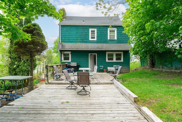 24 Park St, Kingston, NY 12401 - rear view of property with a wooden deck, a yard, a chimney, and roof with shingles