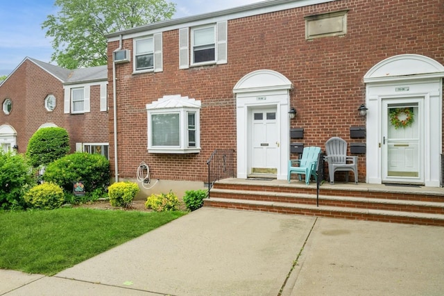 70-08 261th St Unit A1, Glen Oaks, NY 11004 - view of front of house with brick siding and a wall mounted AC