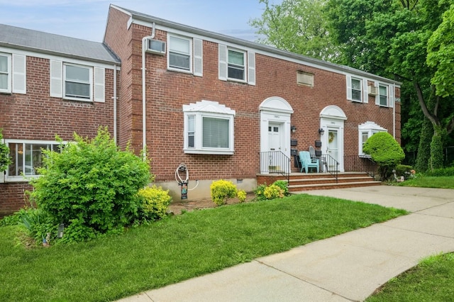 70-08 261th St Unit A1, Glen Oaks, NY 11004 - view of front facade with brick siding and a front yard