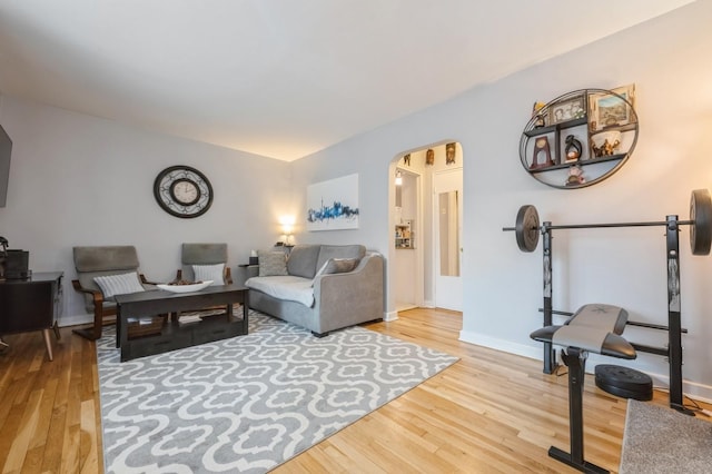 70-08 261th St Unit A1, Glen Oaks, NY 11004 - living room with wood finished floors, arched walkways, and baseboards