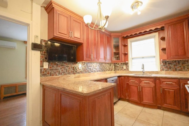kitchen with a sink, dishwasher, a wall mounted AC, a chandelier, and tasteful backsplash