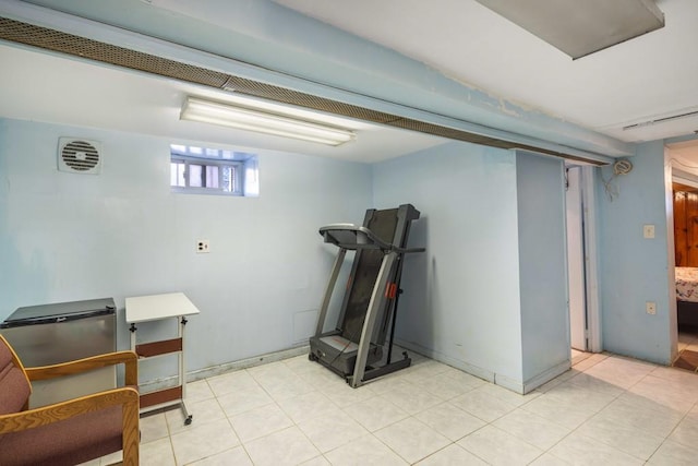 workout room with baseboards