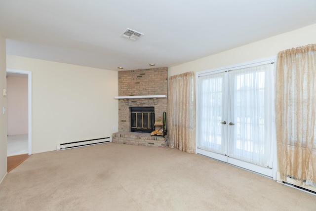 133 Revere Dr, Sayville, NY 11782 - unfurnished living room featuring a baseboard heating unit, carpet, and a fireplace