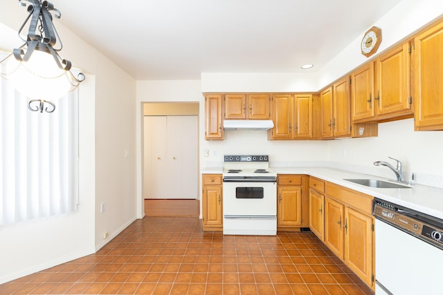 133 Revere Dr, Sayville, NY 11782 - kitchen featuring white appliances, a sink, under cabinet range hood, light countertops, and recessed lighting