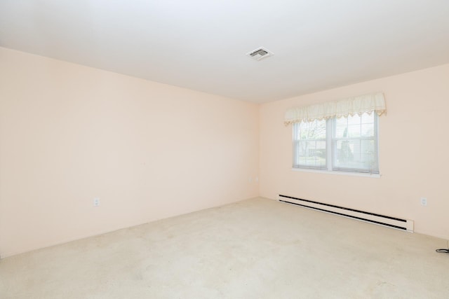 133 Revere Dr, Sayville, NY 11782 - spare room featuring a baseboard heating unit and carpet
