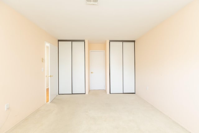 133 Revere Dr, Sayville, NY 11782 - unfurnished bedroom with two closets and carpet