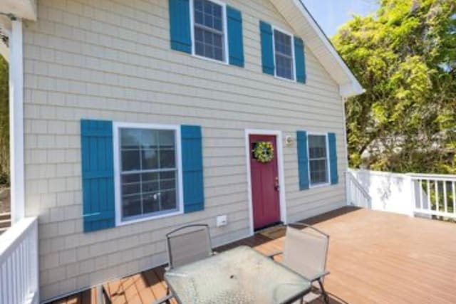 wooden deck with outdoor dining space
