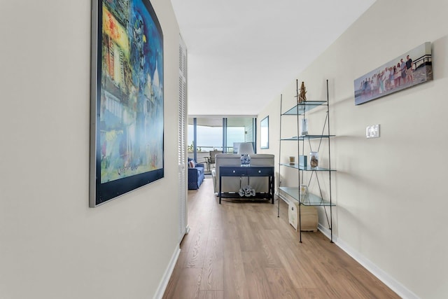 259 Dune Rd Unit 128, Westhampton Beach, NY 11978 - corridor with wood finished floors and baseboards