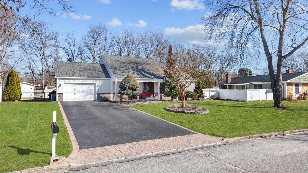 3 Hopewell Dr, Stony Brook, NY 11790 - view of front of home featuring an attached garage, driveway, and brick siding