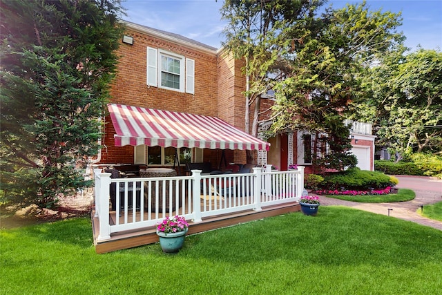 202 Broadway, Lawrence, NY 11559 - view of front of house with a front lawn and brick siding