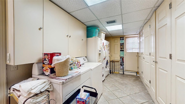 202 Broadway, Lawrence, NY 11559 - washroom featuring cabinet space, washer and clothes dryer, and light tile patterned floors