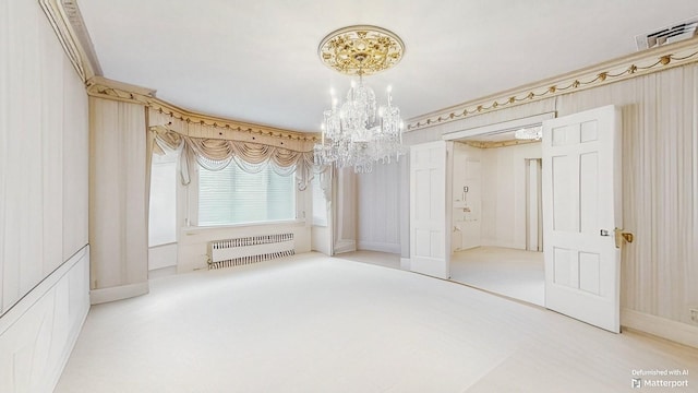 202 Broadway, Lawrence, NY 11559 - unfurnished dining area with radiator heating unit, a chandelier, and carpet flooring