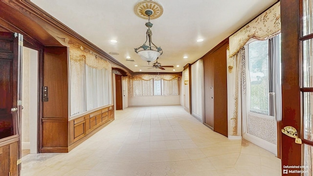 202 Broadway, Lawrence, NY 11559 - hallway featuring healthy amount of natural light, recessed lighting, and crown molding