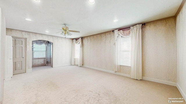 202 Broadway, Lawrence, NY 11559 - spare room with ceiling fan, carpet flooring, arched walkways, wallpapered walls, and recessed lighting