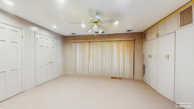 202 Broadway, Lawrence, NY 11559 - unfurnished bedroom with light colored carpet, recessed lighting, and a ceiling fan