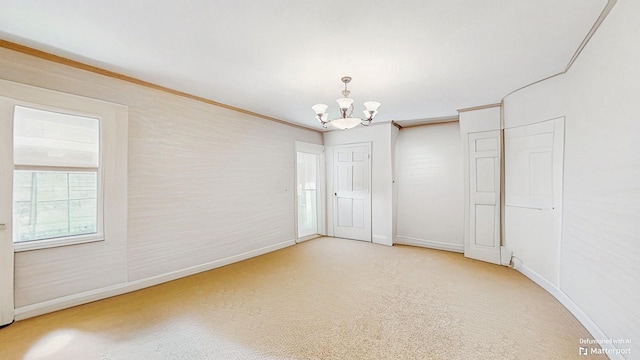 202 Broadway, Lawrence, NY 11559 - spare room with a chandelier and ornamental molding