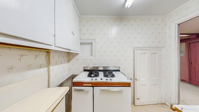 202 Broadway, Lawrence, NY 11559 - kitchen featuring ornamental molding, white gas stovetop, light countertops, and white cabinets
