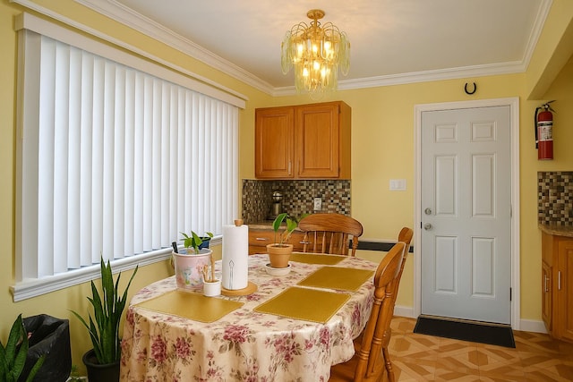 118-37 180th St, Jamaica, NY 11434 - dining room featuring a chandelier, crown molding, and baseboards