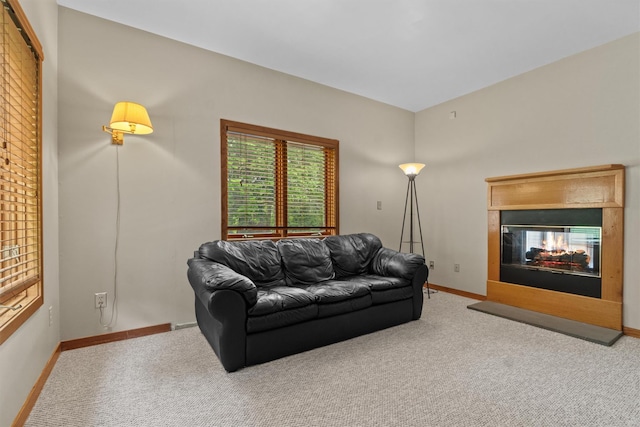115 Moffat Rd, Washingtonville, NY 10992 - living room featuring a multi sided fireplace, carpet floors, and baseboards