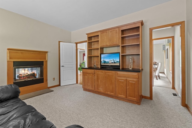 115 Moffat Rd, Washingtonville, NY 10992 - living area featuring light colored carpet, baseboards, and a multi sided fireplace