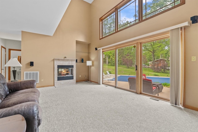 115 Moffat Rd, Washingtonville, NY 10992 - living area featuring a high ceiling, carpet flooring, baseboards, and a fireplace