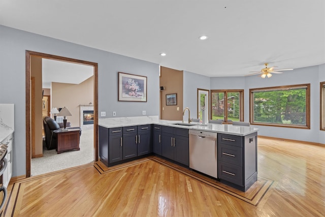 115 Moffat Rd, Washingtonville, NY 10992 - kitchen with stainless steel dishwasher, a sink, a peninsula, light wood-style floors, and recessed lighting