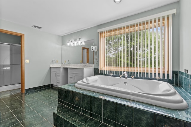 115 Moffat Rd, Washingtonville, NY 10992 - bathroom with vanity, tile patterned floors, a bath, and a stall shower