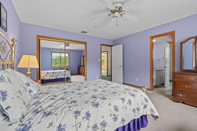 115 Moffat Rd, Washingtonville, NY 10992 - bedroom with light colored carpet, a closet, baseboards, ceiling fan, and connected bathroom