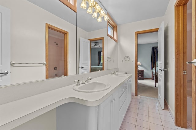 115 Moffat Rd, Washingtonville, NY 10992 - ensuite bathroom featuring tile patterned floors, double vanity, and baseboards