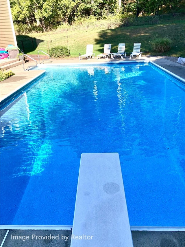 115 Moffat Rd, Washingtonville, NY 10992 - outdoor pool featuring a diving board and a patio