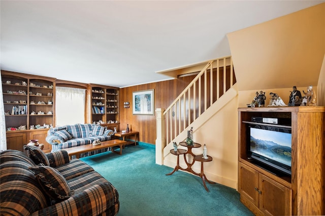 9 Lakeland Ave, Patchogue, NY 11772 - carpeted living room featuring stairs, wooden walls, and baseboards
