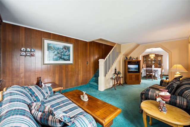 9 Lakeland Ave, Patchogue, NY 11772 - living area with carpet flooring, stairs, wood walls, and crown molding