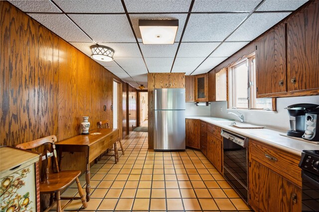 9 Lakeland Ave, Patchogue, NY 11772 - kitchen with freestanding refrigerator, dishwasher, light countertops, a drop ceiling, and stove