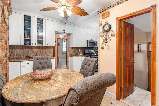 dining space featuring a ceiling fan