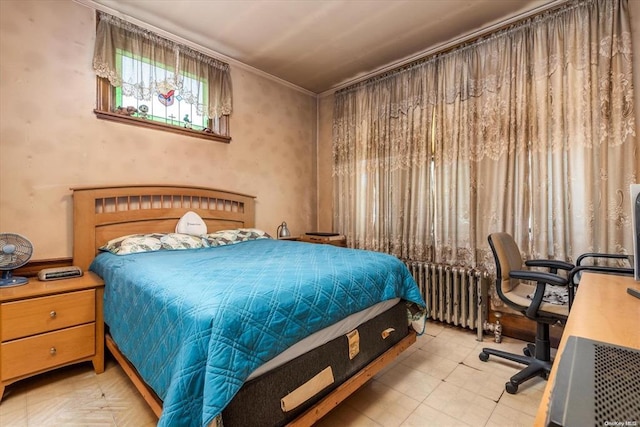 bedroom featuring radiator heating unit, ornamental molding, and tile patterned floors
