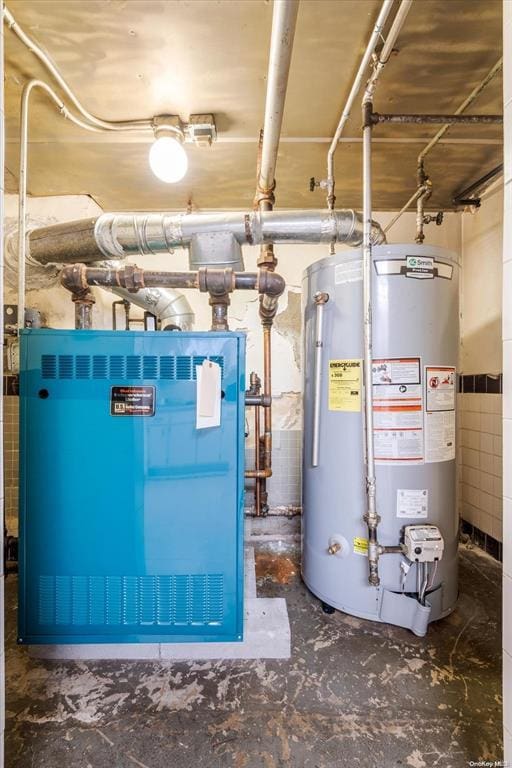 utility room featuring gas water heater