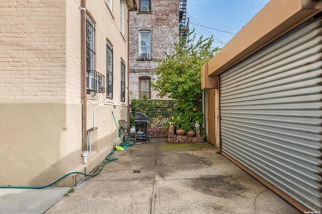 view of patio featuring a grill
