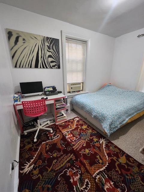 35-27 81st St Unit 2, Jackson Heights, NY 11372 - bedroom with cooling unit and an office area