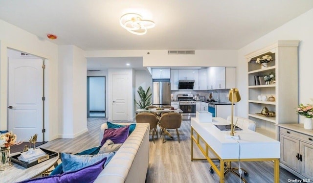 144-27 Sanford Ave Unit 2K, Flushing, NY 11355 - living room with light wood-type flooring