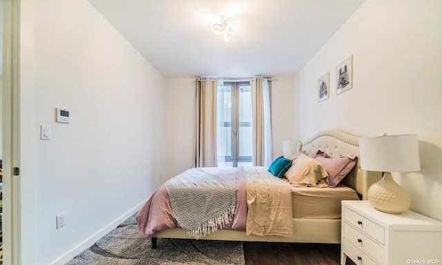 144-27 Sanford Ave Unit 2K, Flushing, NY 11355 - bedroom featuring baseboards and dark wood-style floors