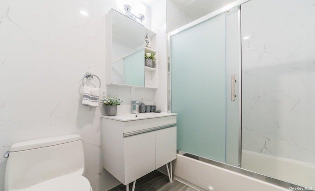 144-27 Sanford Ave Unit 2K, Flushing, NY 11355 - bathroom with toilet, vanity, and combined bath / shower with glass door