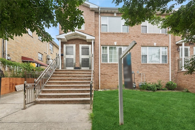 61-31 136th St, Flushing, NY 11367 - view of front facade featuring a front yard and brick siding