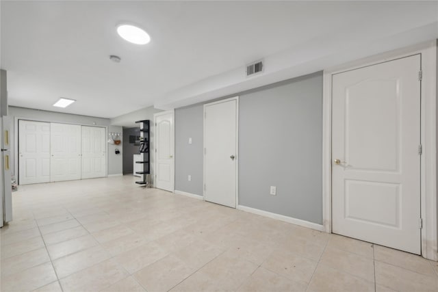 61-31 136th St, Flushing, NY 11367 - basement with light tile patterned floors and baseboards