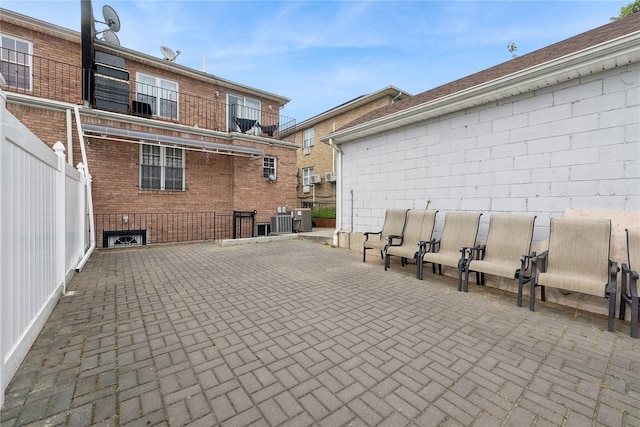 61-31 136th St, Flushing, NY 11367 - view of patio featuring central AC and fence