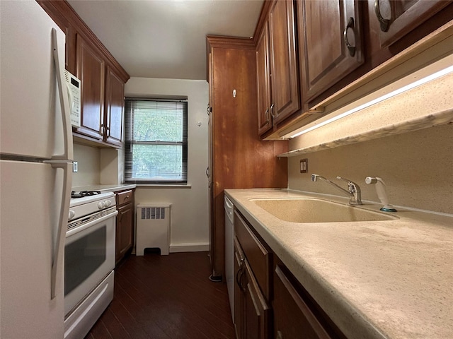 8 W Mill Dr Unit 1B, Great Neck, NY 11021 - kitchen with white appliances, radiator, a sink, light countertops, and dark wood finished floors