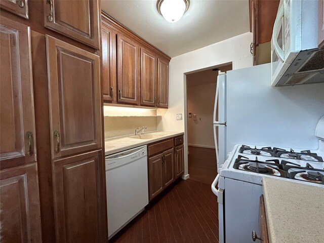 8 W Mill Dr Unit 1B, Great Neck, NY 11021 - kitchen featuring white appliances, a sink, and light countertops