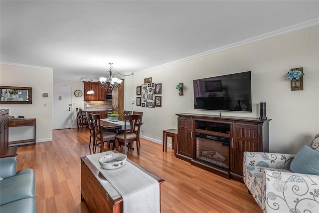 17-85 215th St Unit 4B, Bayside, NY 11360 - living room featuring a chandelier, ornamental molding, light wood-type flooring, and baseboards