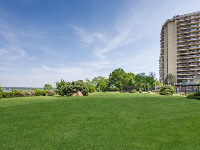 17-85 215th St Unit 4B, Bayside, NY 11360 - view of property's community with a lawn