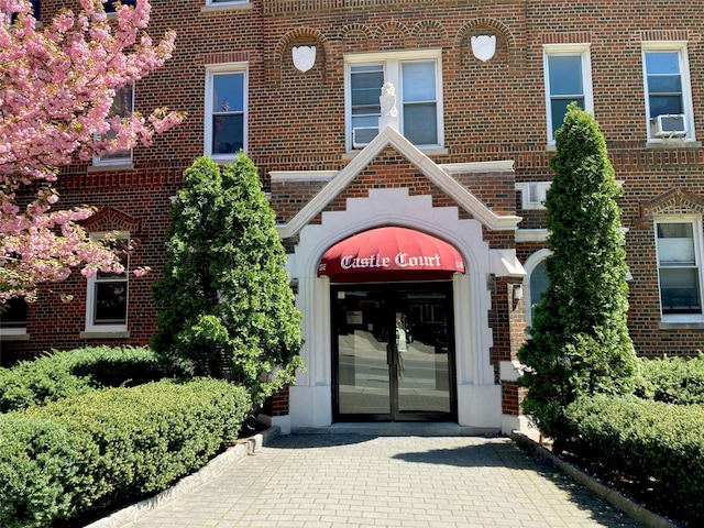 83-55 Lefferts Blvd Unit 1E, Kew Gardens, NY 11415 - entrance to property with brick siding and cooling unit