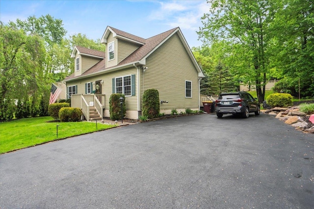 3 Pine Ln, Greenwood Lake, NY 10925 - view of front of home with a front yard, a shingled roof, and driveway